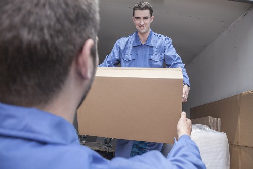 Flat removal team handling furniture move in Hounslow apartment building