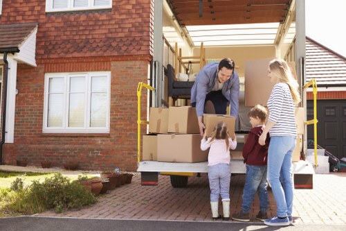 Removal team loading household items in a Hounslow move