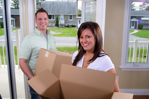 Furniture removals team handling heavy household furniture in Hounslow