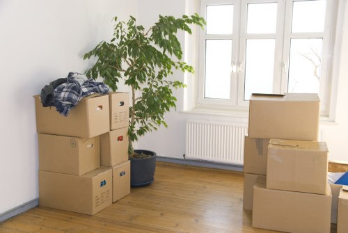 Careful loading of household items for a move in West London