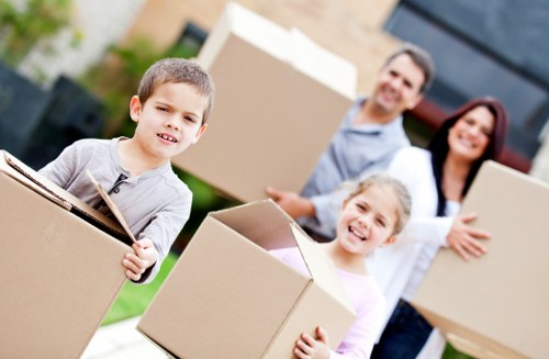 Furniture and boxes being loaded into a truck for transport in Hounslow